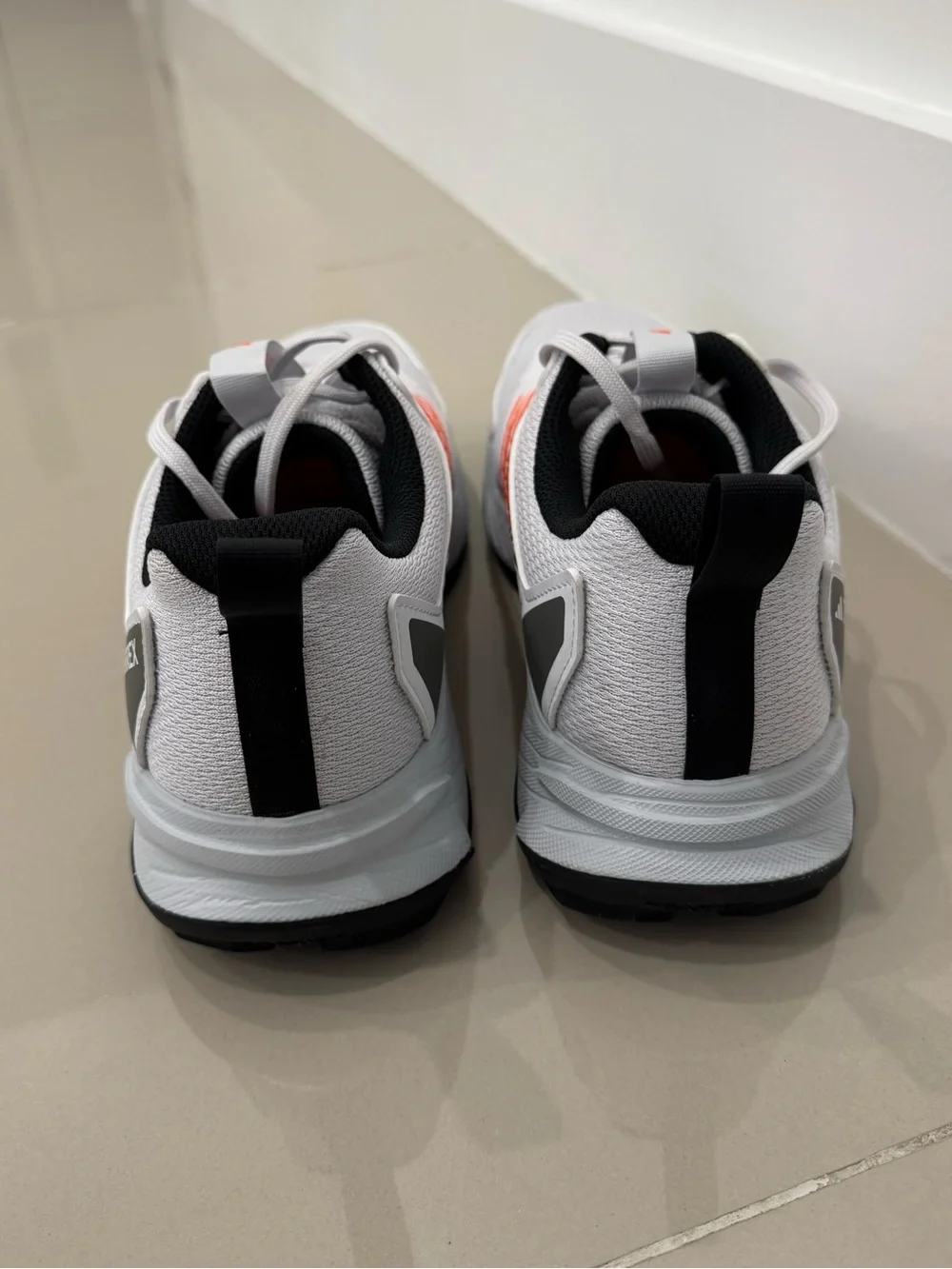Adidas Men's White Athletic Shoes with Orange Accents